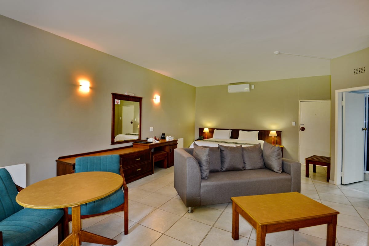 The family room: a sofa and table in front of the bed